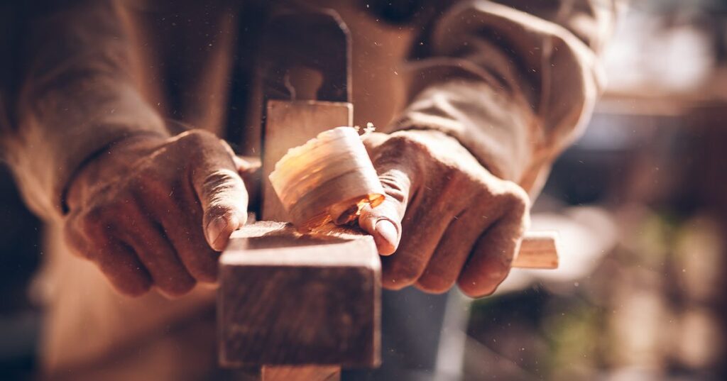 Ageing hands working with timber